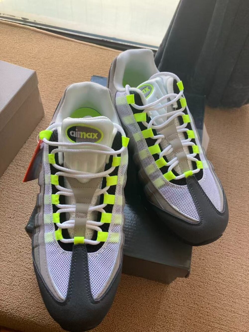 Air cushion running shoes gray/volt. Sports shoes have visible air cushioning,